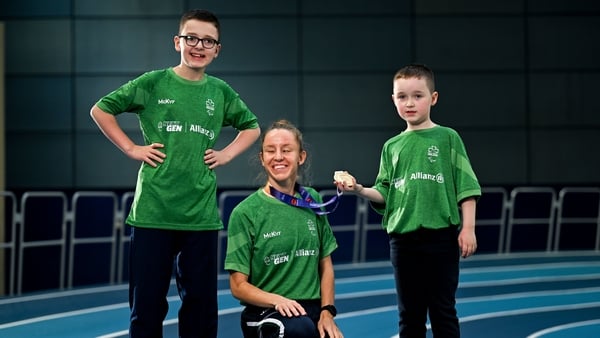 18 November 2025; Paralympian and world gold medalist Greta Streimikyte pictured alongside JJ Peppard, aged 14, left, and Tadhg Peppard, aged 8, from Blanchardstown in Dublin ahead of Allianz NextGen which is taking place on November 30th at the National