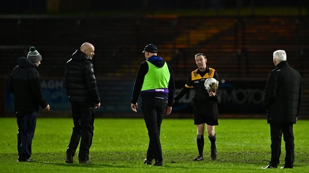 23 November 2025; Referee Joe McQuillan abandons the AIB Ulster GAA Football Senior Club Championship semi-final match between Scotstown and Newbridge at O'Neill's Healy Park in Omagh, Tyrone. Photo by Ben McShane/Sportsfile