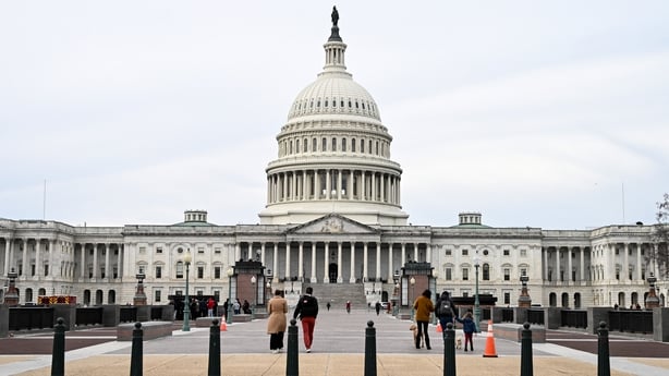 Pedestrians walk on Capitol Hill in Washington, DC, US, on Thursday, Nov. 27, 2025. President Donald Trump ordered an additional 500 troops deployed to the nation's capital after a pair of National Guardsmen were shot just blocks from the White House and left in critical condition on Wednesday. Phot