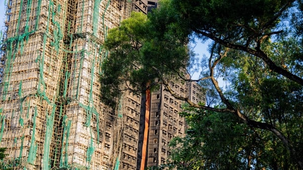 The destroyed facade of towers following a fire at the Wang Fuk Court residential estate in Tai Po district in Hong Kong, China, on Friday, Nov. 28, 2025. Hong Kong's deadliest fire in nearly eight decades has killed at least 128, city officials announced shortly after making fresh arrests in connec