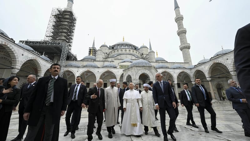 Pope Leo XIV was shown around the Blue Mosque by a group of Turkish dignitaries