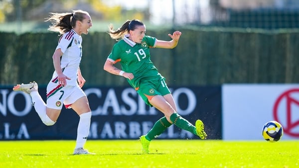 29 November 2025; Abbie Larkin of Republic of Ireland scores her side's first goal despite the attention of Henrietta Csiszar of Hungary during the women's international friendly match between Republic of Ireland and Hungary at Marbella Football Centre in