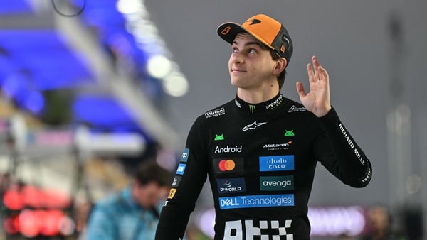 McLaren's Australian driver Oscar Piastri waves to the fans
