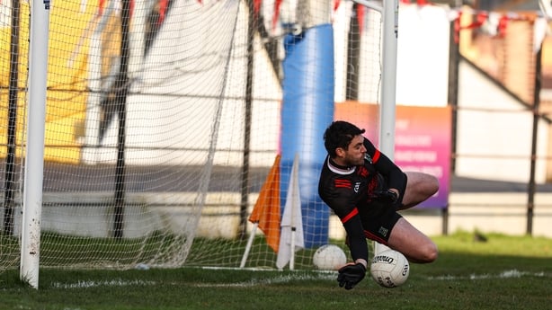Athy goalkeeper James Roycroft saves a penalty 