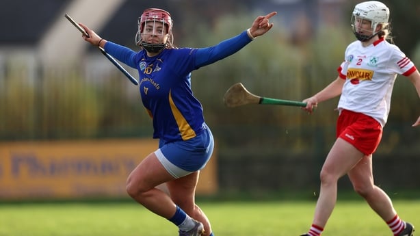 Sorcha McCartan celebrates with her arms out wide 