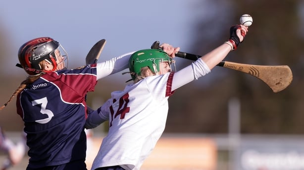 Sabina Rabbitte with Dicksboro's Tara Clifford reaching for a caught ball 