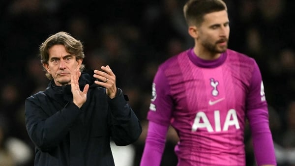 Tottenham Hotspur's Danish head coach Thomas Frank applauds the fans as Tottenham Hotspur's Italian goalkeeper #01 Guglielmo Vicario reacts following the English Premier League football match between Tottenham Hotspur and Fulham at the Tottenham Hotspur S