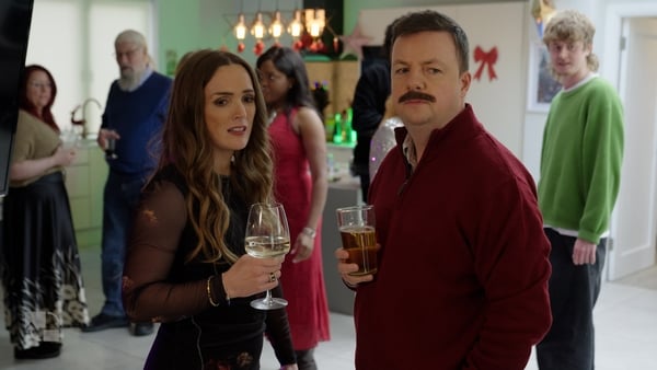 Emma Doran and Oliver Callan in character at a party