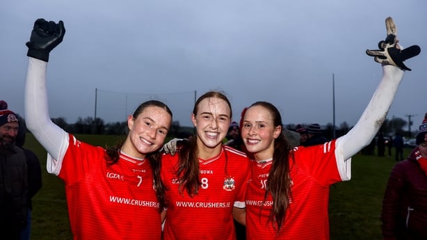 30 November 2025; Kilkerrin-Clonberne players, from left, Niamh Divilly, Siobhan Divilly, Olivia Divilly celebrate after their side's victory in the AIB All-Ireland Ladies Football Club Senior Club Championship semi-final match between Kilkerrin-Clonberne of Galway and Comeragh Rangers of Waterford 
