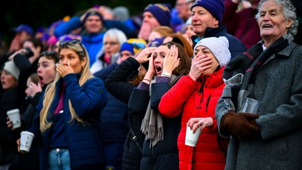 30 November 2025; Kilmacud Crokes supporters react during the 2025 AIB All-Ireland Ladies Football Club Senior Club Championship semi-final match between Kilmacud Crokes of Dublin and St Ergnat's of Antrim at Páirc de Burca in Stillorgan, Dublin. Photo by Shauna Clinton/Sportsfile 