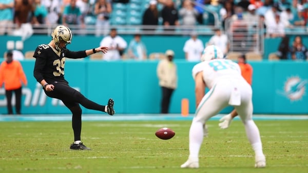 MIAMI GARDENS, FLORIDA - NOVEMBER 30: Charlie Smyth #39 of the New Orleans Saints attempts an onside kick against the Miami Dolphins during the fourth quarter at Hard Rock Stadium on November 30, 2025 in Miami Gardens, Florida. (Photo by Megan Briggs/Gett