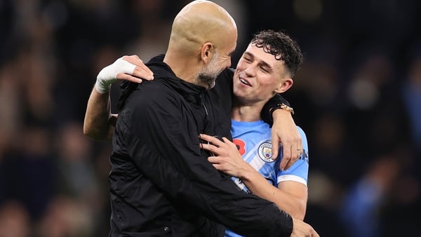 MANCHESTER, ENGLAND - NOVEMBER 9: Manchester City manager Pep Guardiola laughs and smiles with Phil Foden of Manchester City after the Premier League match between Manchester City and Liverpool at Etihad Stadium on November 9, 2025 in Manchester, England.