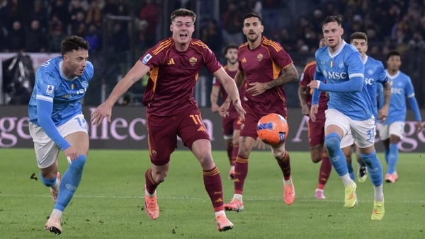 Napoli's Kosovo defender #13 Amir Rrahmani vies with Roma's Irish forward #11 Evan Ferguson during the Italian Serie A football match between AS Roma and Napoli at the Olympic Stadium in Rome on November 30, 2025. (Photo by Tiziana FABI / AFP)