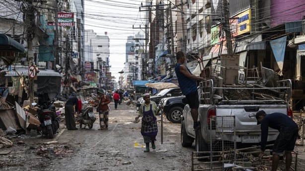 HAT YAI, THAILAND - NOVEMBER 29: People are seen cleaning up damage in the commercial district in downtown Hat Yai as the flood waters receded on November 29, 2025 in Hat Yai, Thailand. Although the official number is still unconfirmed, the death toll of Hat Yai City alone is reportedly in the hundr