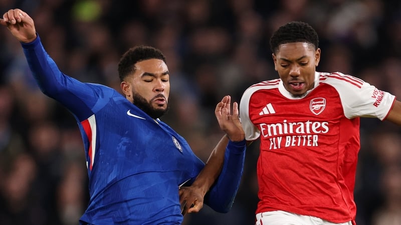 Reece James (L) battles for possession with Myles Lewis-Skelly