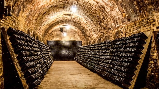 champagne bottles maturing in cellar
