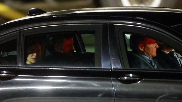 Ukrainian President Volodymyr Zelensky and his wife Olena Zelenska drive away from airport runway