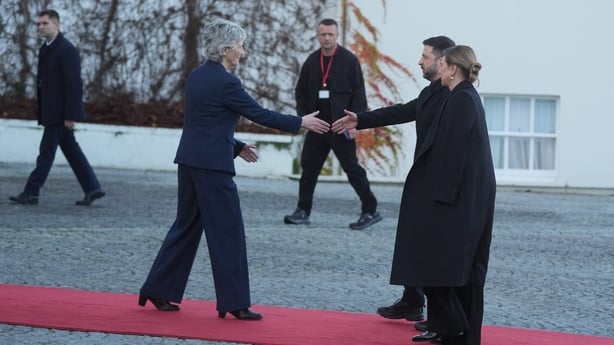 President Catherine Connolly reaches out to shake the hand of Volodymyr Zelensky as his wife looks on