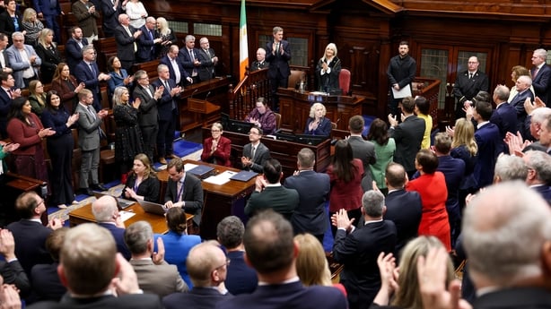 Volodymyr Zelensky receives a standing ovation after his address in the Dail chamber