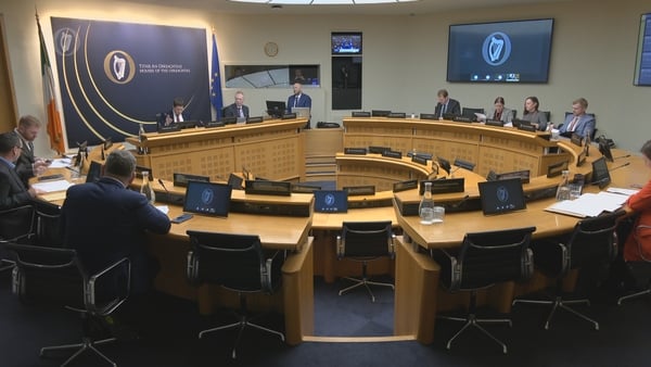 Members of the Oireachtas Justice Committee sit during today's hearing