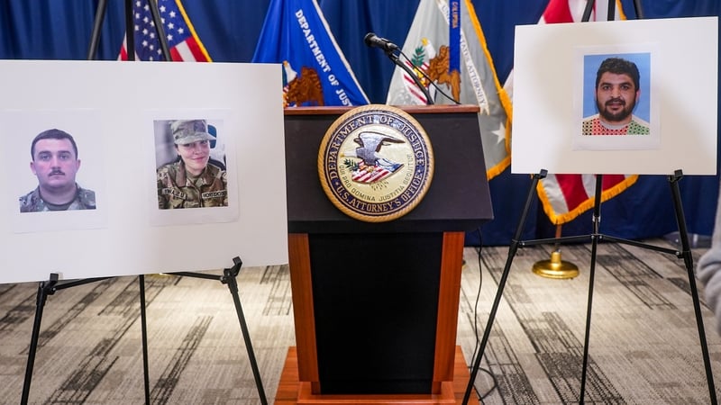 Portraits of National Guard members Sarah Beckstrom (2nd from L) and Andrew Wolfe (L) opposite one of suspected shooter Rahmanullah Lakanwal