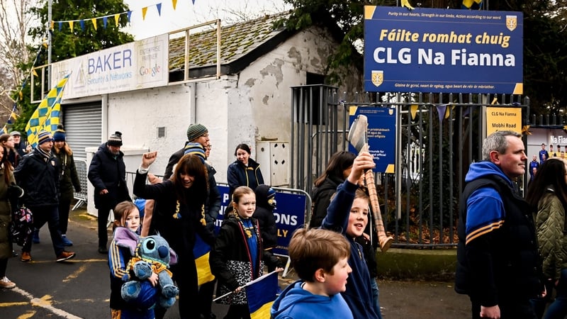 Na Fianna supporters walking from their club grounds in Glasnevin to Croke Park for the 2025 All-Ireland club hurling final
