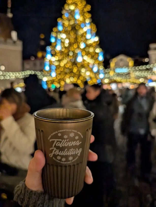Enjoying a mulled wine at the Christmas market (Rachael Davis/PA)