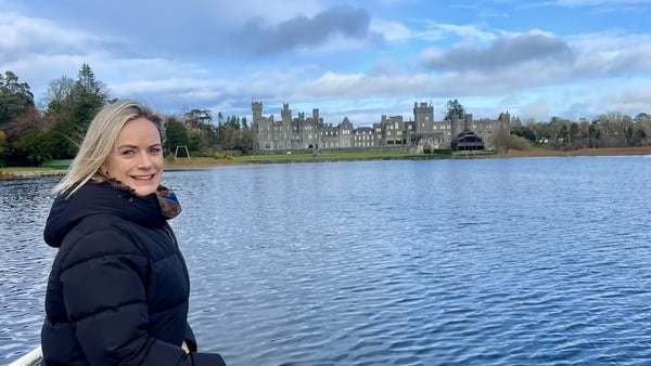 Deirdre Mullins on a boat in front of Ashford Castle