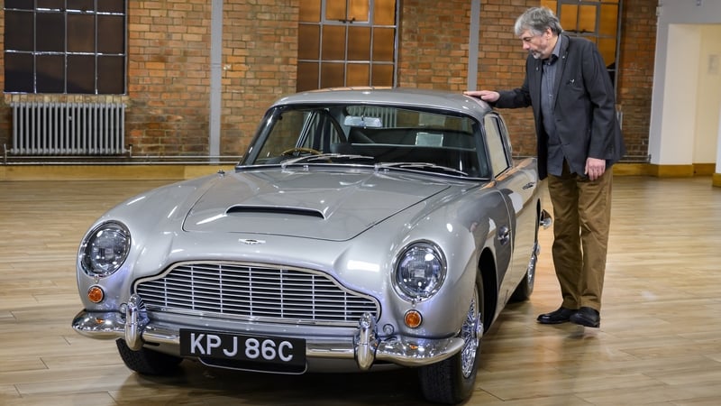 John Williams with his restored Aston Martin DB5 Vantage sports car. Photo credit: Aston Martin/PA Wire