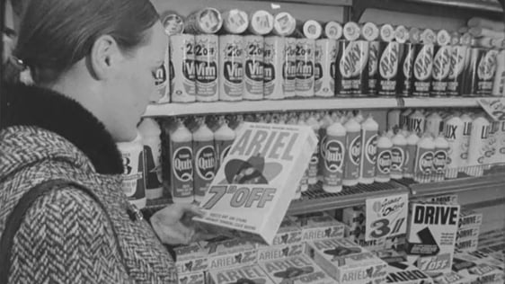 A shoppers holding a box of soap-powder displaying a price discount in 1971.