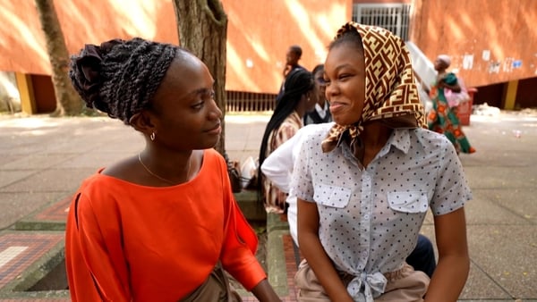 Two young Nigerian women are pictured in Logos, Nigeria