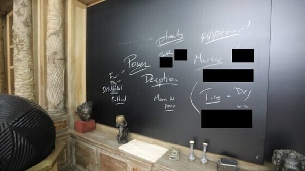 Interior photo of room with blackboard from Epstein island