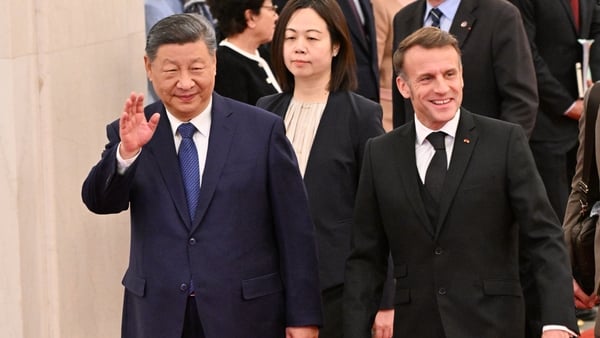 China's President Xi Jinping (L) and France's President Emmanuel Macron attend a welcome ceremony at the Great Hall of the People in Beijing on December 4, 2025. (Photo by Adek BERRY and ADEK BERRY / POOL / AFP)