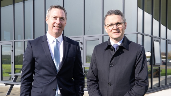 NBI CEO TJ Malone and Minister for Arts, Culture, Communications Patrick O'Donovan stand for a photo at Manor Fields in Adare