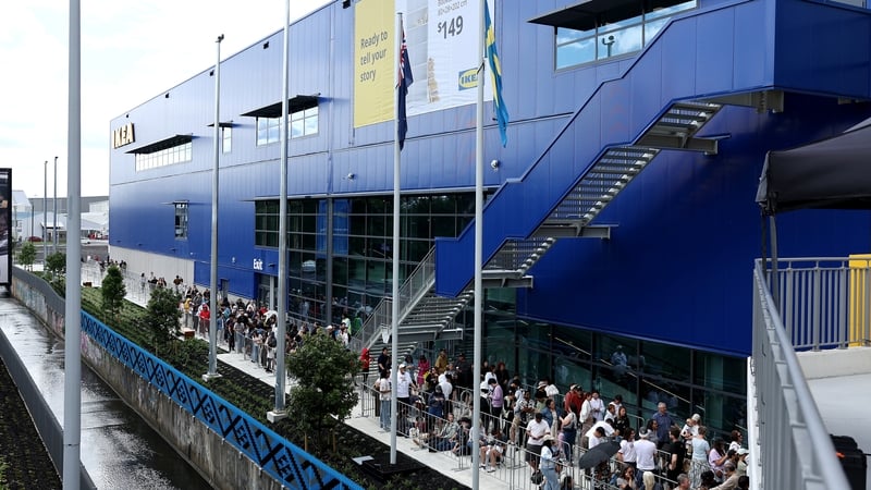 People queue outside the new IKEA store in Auckland in New Zealand today