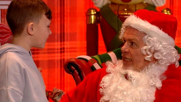 Darren pulls down the Santa beard to reveal that it's really Pete