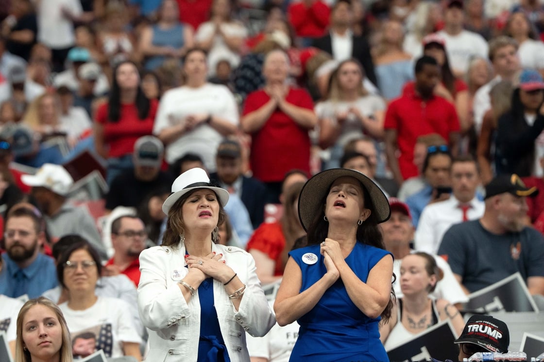 Two women react at the memorial service in Glendale, Arizona, on 21 September