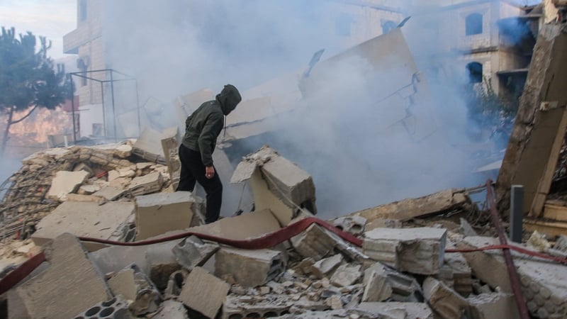 A man examines a building destroyed in an Israeli strike in Lebanon