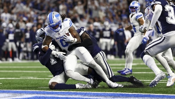 DETROIT, MICHIGAN - DECEMBER 4: Jahmyr Gibbs #0 of the Detroit Lions runs with the ball to score a touchdown during the fourth quarter of an NFL football game against the Dallas Cowboys at Ford Field on December 4, 2025 in Detroit, Michigan. (Photo by Kev