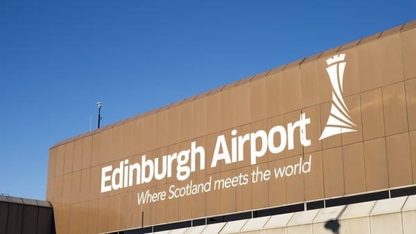 A large sign on the outside of the main terminal building of Edinburgh Airport