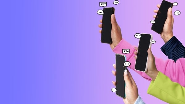 Hands holding smartphones on coloured background