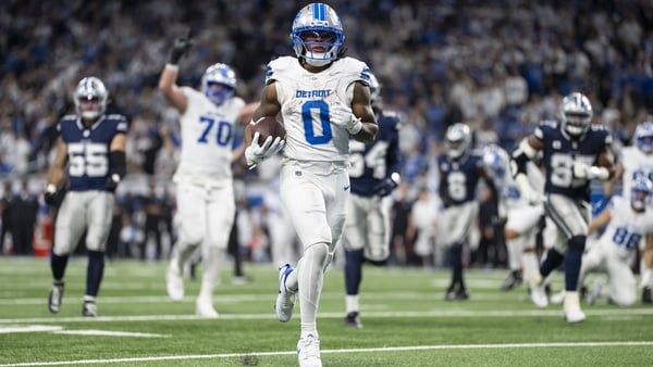 Jahmyr Gibbs of the Detroit Lions runs in one of his three touchdowns against the Dallas Cowboys