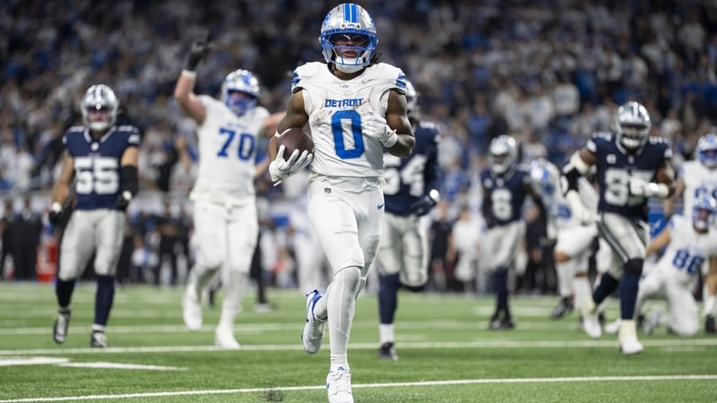Jahmyr Gibbs of the Detroit Lions runs in one of his three touchdowns against the Dallas Cowboys