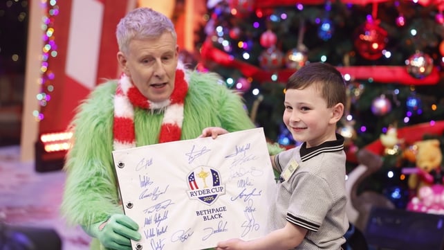 Toy Show tester Declan shows off his autographs from Europe's Ryder Cup Team