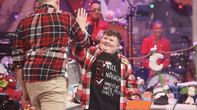 Toy Show tester Shay from Cork high-fives Patrick Kielty