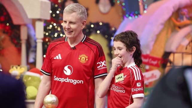 Liverpool fan Layla from Co Kildare has a laugh with long-suffering Manchester United fan Patrick Kielty