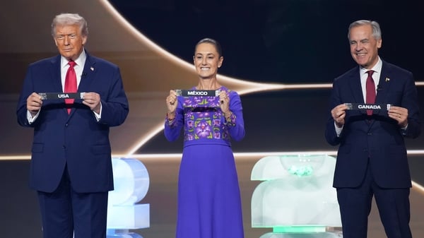 WASHINGTON, DC - DECEMBER 05: U.S. President Donald Trump, Mexican President Claudia Sheinbaum, and Canadian Prime Minister Mark Carney participate in the FIFA World Cup 2026 Official Draw with at the John F. Kennedy Center for the Performing Arts Decembe