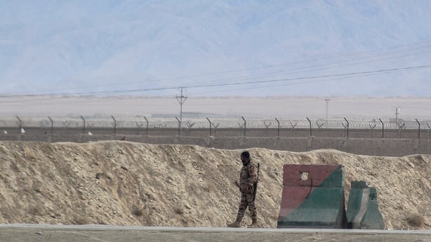 A security personnel stands guard at the Pakistan-Afghanistan border