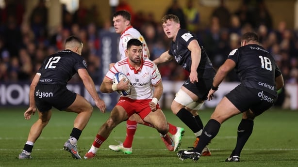 BATH, ENGLAND - DECEMBER 06: Dan Kelly of Munster looks to take on Cameron Redpath and Thomas du Toit of Bath during the Investec Champions Cup match between Bath Rugby and Munster Rugby at The Recreation Ground on December 06, 2025 in Bath, England. (Photo by Michael Steele/Getty Images)