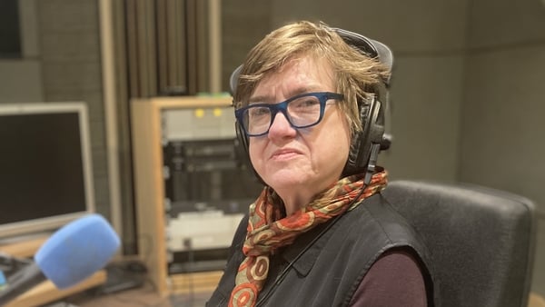 writer Helen O'Rahilly in RTÉ radio studio for Sunday Miscellany, sitting behind mic, looking sideways to camera, Dec 2025
